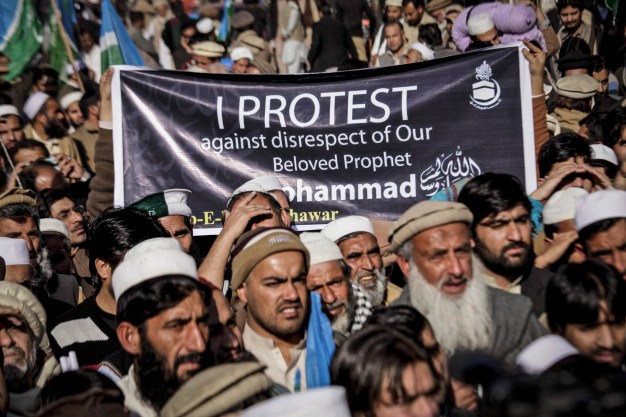 epa04562969 Supporters of the Islamic political party Jamat-e-Islami rally against the French magzine 'Charlie Hebdo' for publishing the caricatures of the prophet Mohammed, in Peshawar, Pakistan, 16 January 2015. Thousands of police and paramilitary troops were deployed across Pakistan ahead of rallies against caricatures of the Muslim prophet Muhammad in the French satirical magazine Charlie Hebdo, officials said. Several Islamic groups and right-wing political parties called for countrywide protests after Friday prayers to condemn the publication of the images. EPA/BILAWAL ARBAB